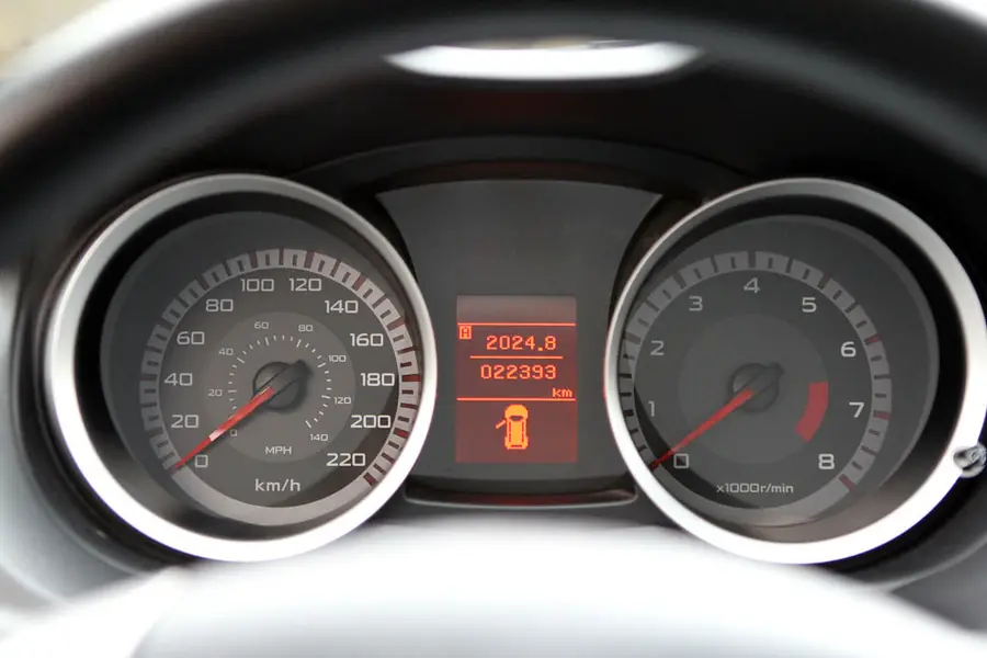 A car instrument cluster with warning lights