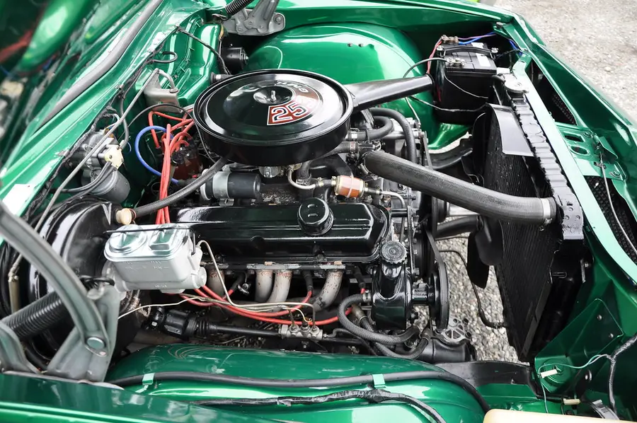 A car engine bay under an open hood