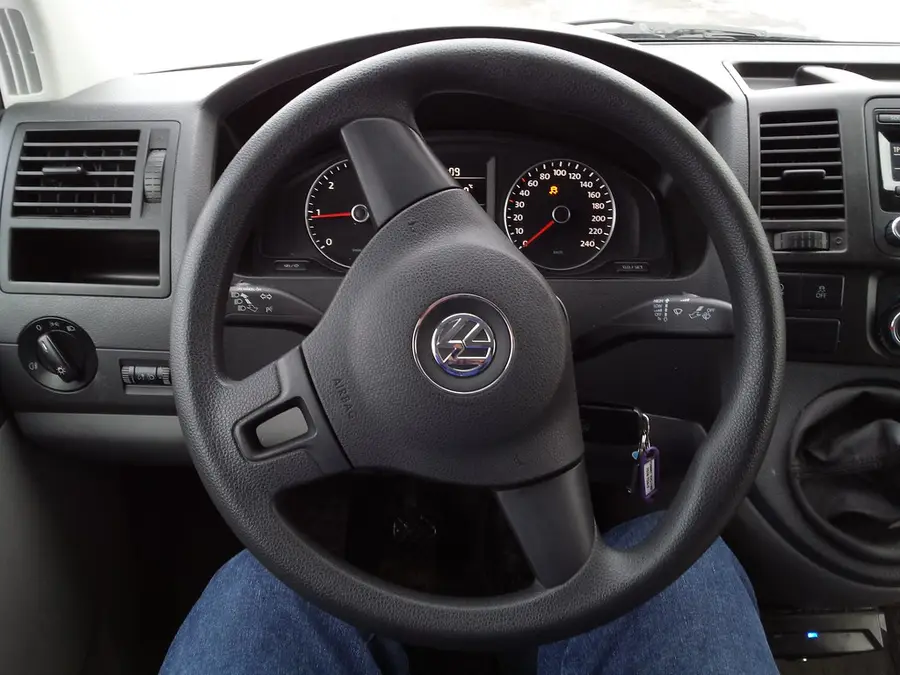 A car's steering wheel and dashboard